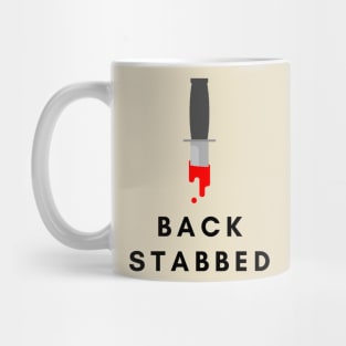 Stabbed in the back- a back stabbing design Mug